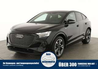 Schräge Frontansicht auf einen Audi Q4 e-tron , freigestellt